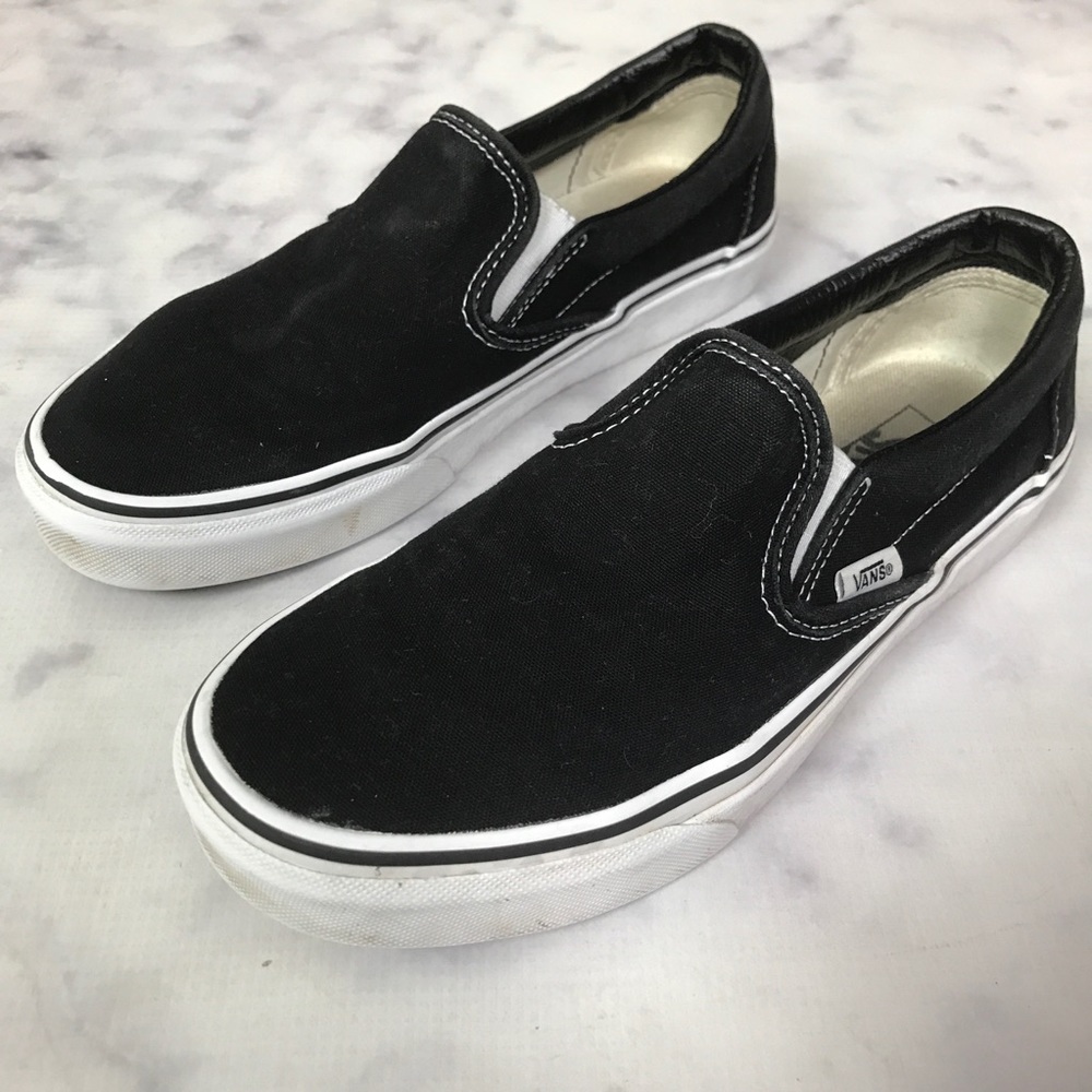 vans black slip ons